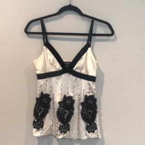 Bebe 100% silk beaded tank with appliqué.
